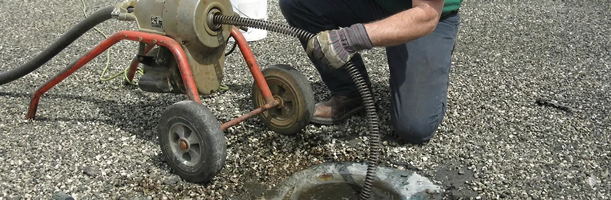 sewer rodding technician actively removing blockages from a sewer line in Oklahoma City, OK